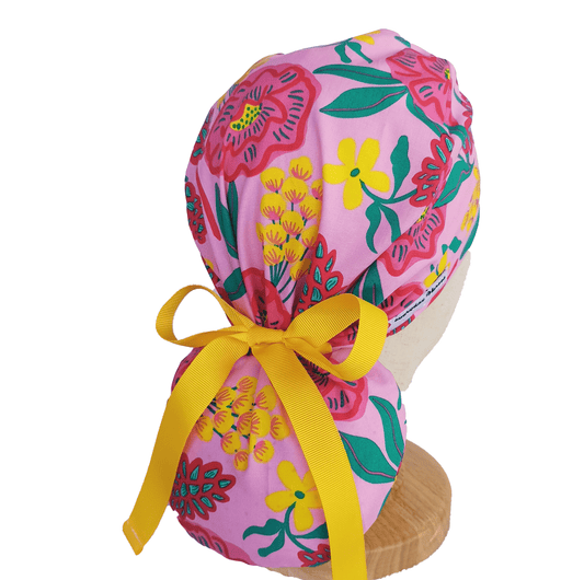 Pink scrub cap with flowers andyellow ribbon