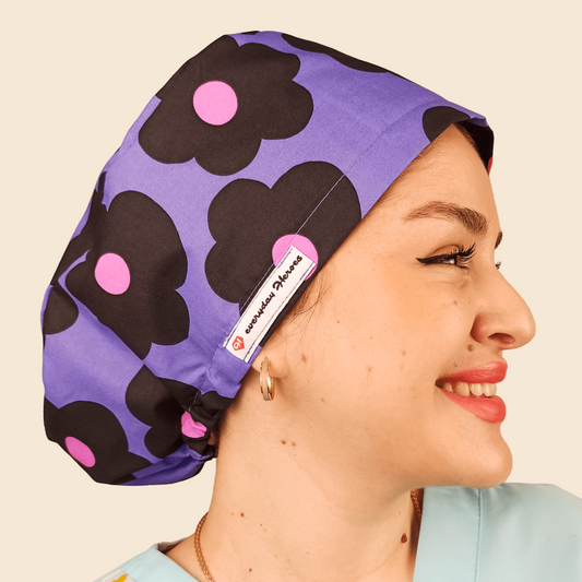 purple scrub cap with black and pink daisies, euro style surgical cap
