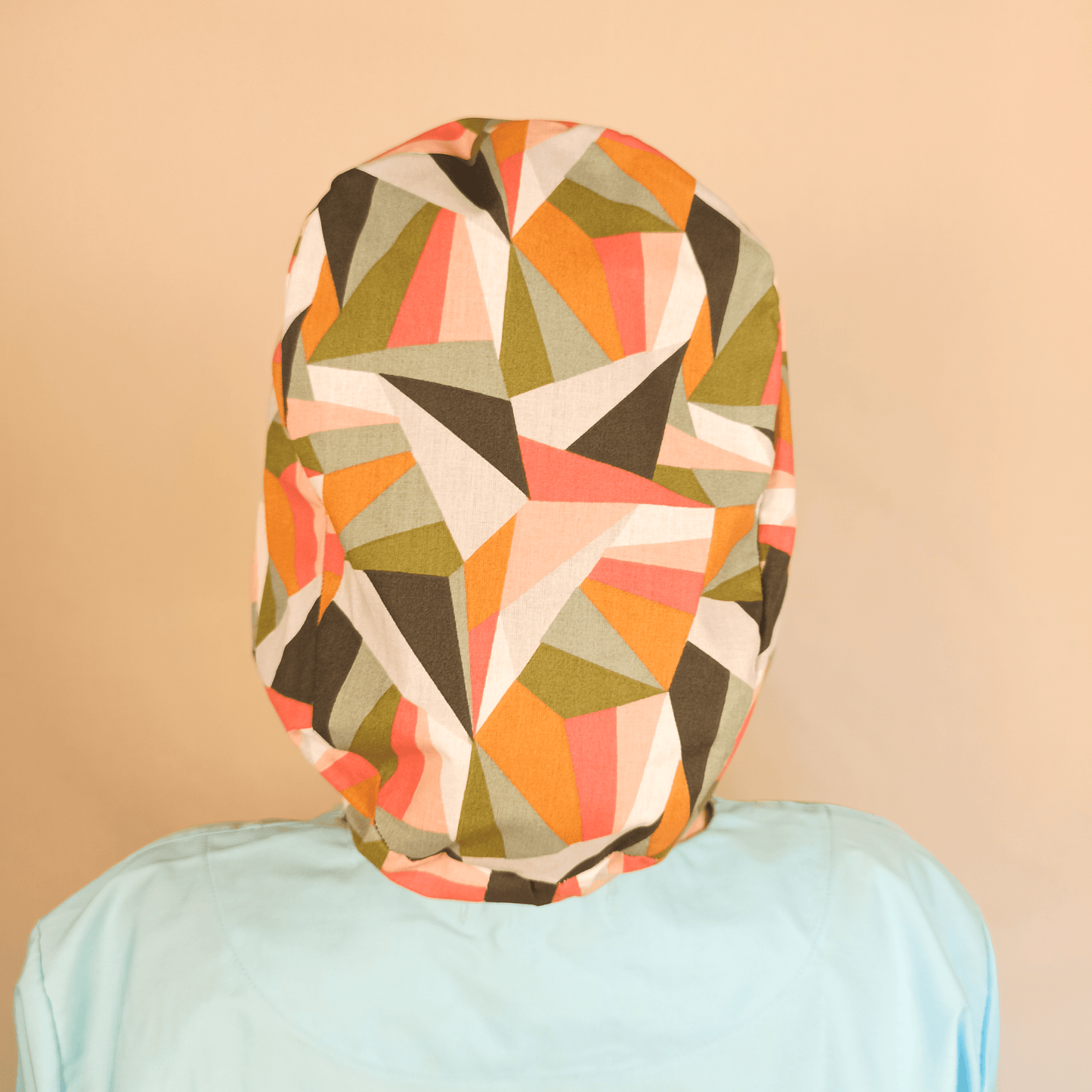 Retro geometric scrub cap for women featuring colorful Euro style design with satin lining option. Custom surgical cap ideal for nurses, doctors, estheticians, or anatomy students. Comfortable and stylish medical scrub hat perfect for esthetician business use, healthcare professionals, or anyone seeking a unique surgical cap with modern geometric print.