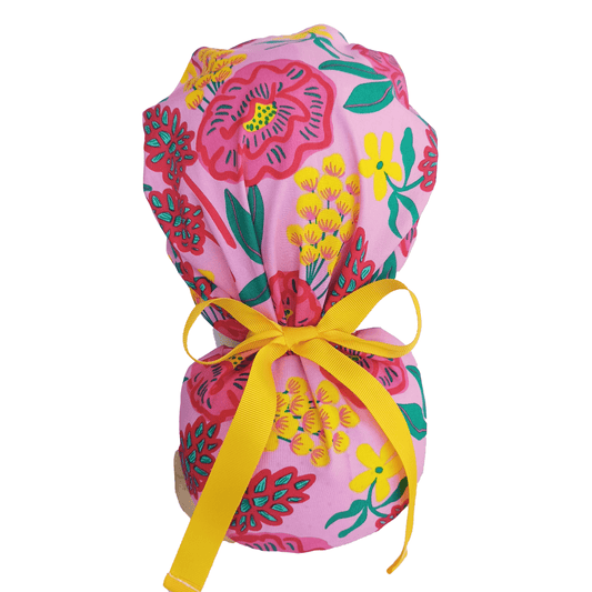 Pink scrub cap with flowers andyellow ribbon 