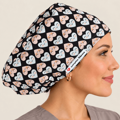 A woman in profile wearing a black scrub cap with a repeating pattern of light blue and peach hearts with small medical symbols. 