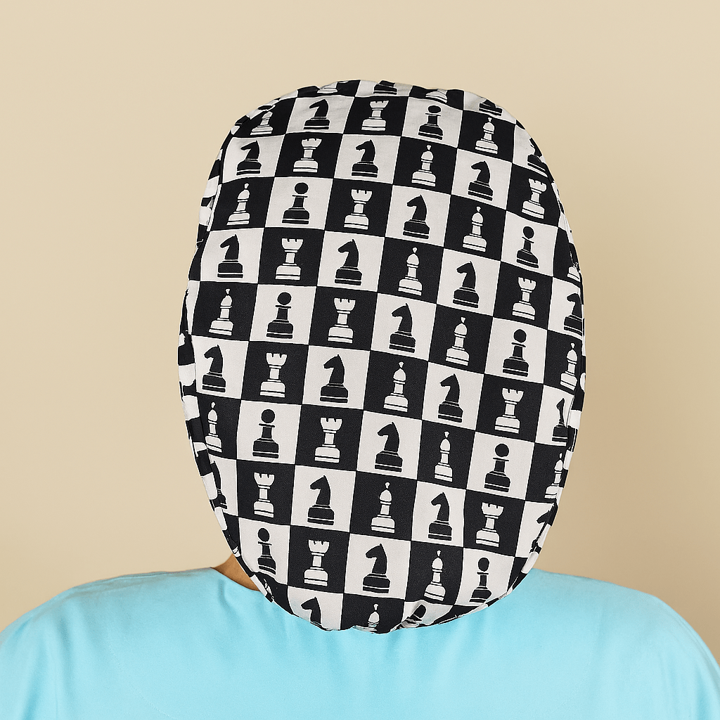 a person wearing a hat with a pattern of chess pieces on it.