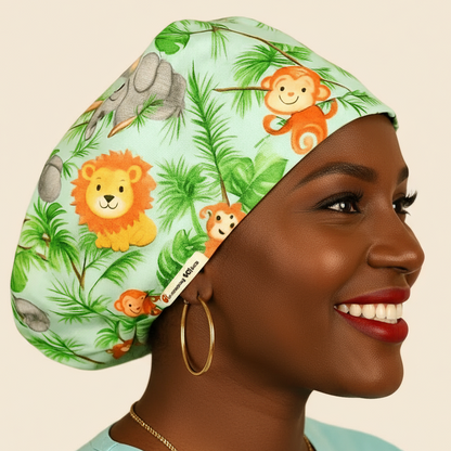 A woman wearing a green cap with a jungle-themed design and smiling at the camera.