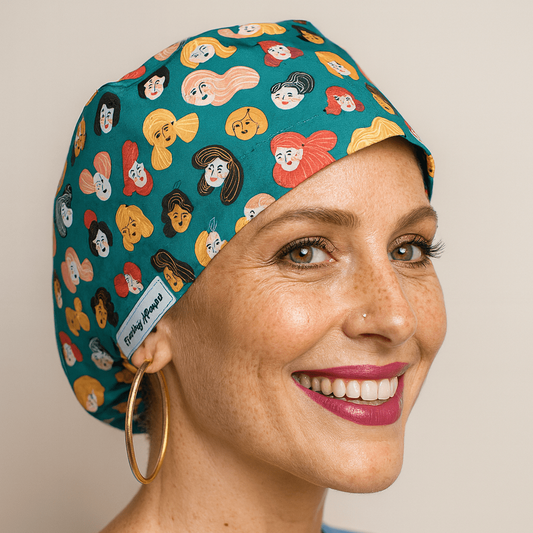 Smiling woman wearing a teal scrub cap with colorful cartoon faces print. Euro style satin-lined surgical cap with buttons, designed for nurses, injectors, and dental or medical professionals. Comfortable, fun, and ideal as a gift for healthcare workers.