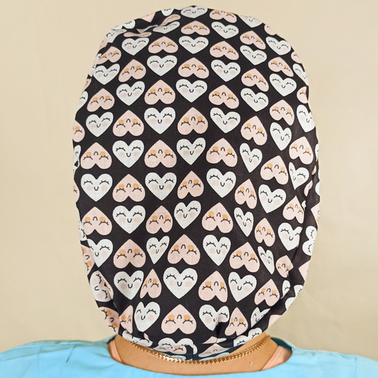 Floral custom satin lined scub cap for women pink ribbon for your ponytail at back, a nurse wearing and smilling this floral scrub cap