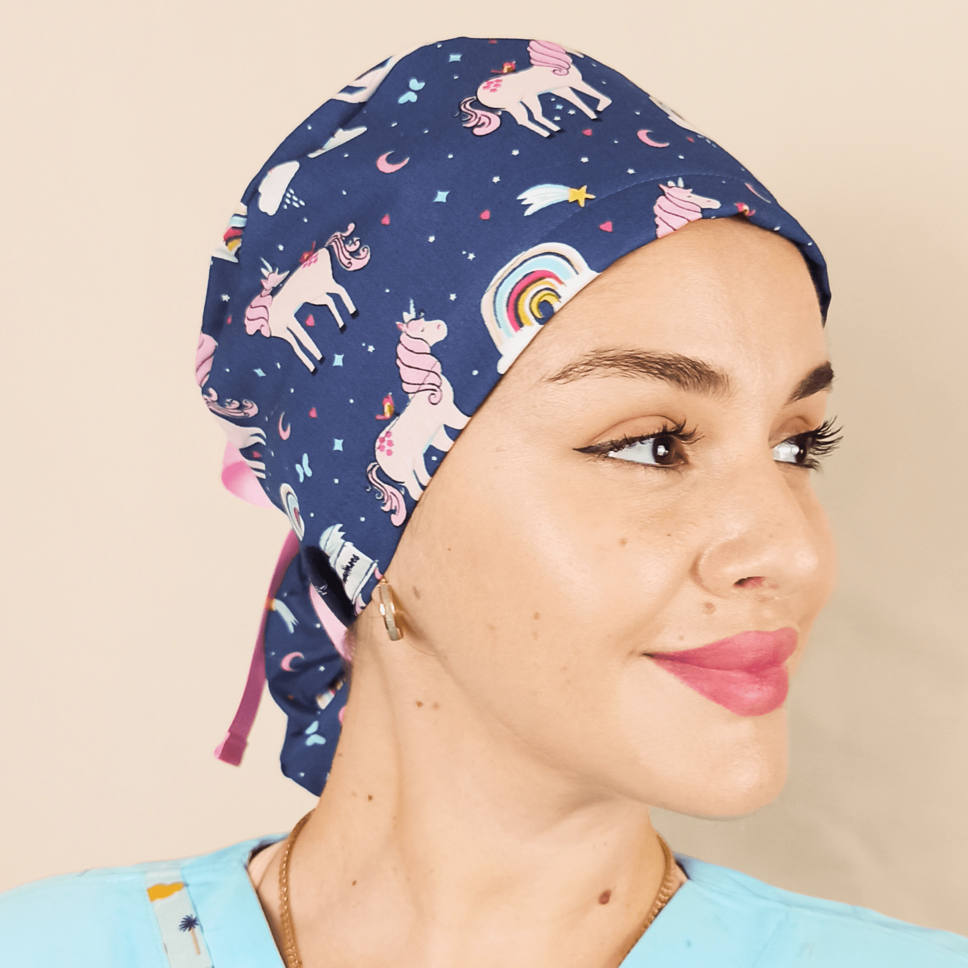 ponytail scrub cap with unicorns theme and rainbows on it , blue pink ribbons and satin lined inside or your name with embroidery customization service from our shop