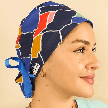 Blue abstract scrub cap satin lined custom with name orange blue colors