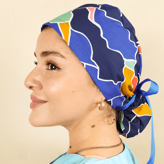 Blue abstract scrub cap satin lined custom with name orange blue colors