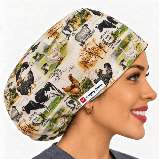 A smiling woman in profile wearing a fabric scrub cap with a vintage-style farm illustration print featuring cows, chickens, ducks, and handwritten text. The scrub cap has a white brand tag reading 'country homes' with a red logo.