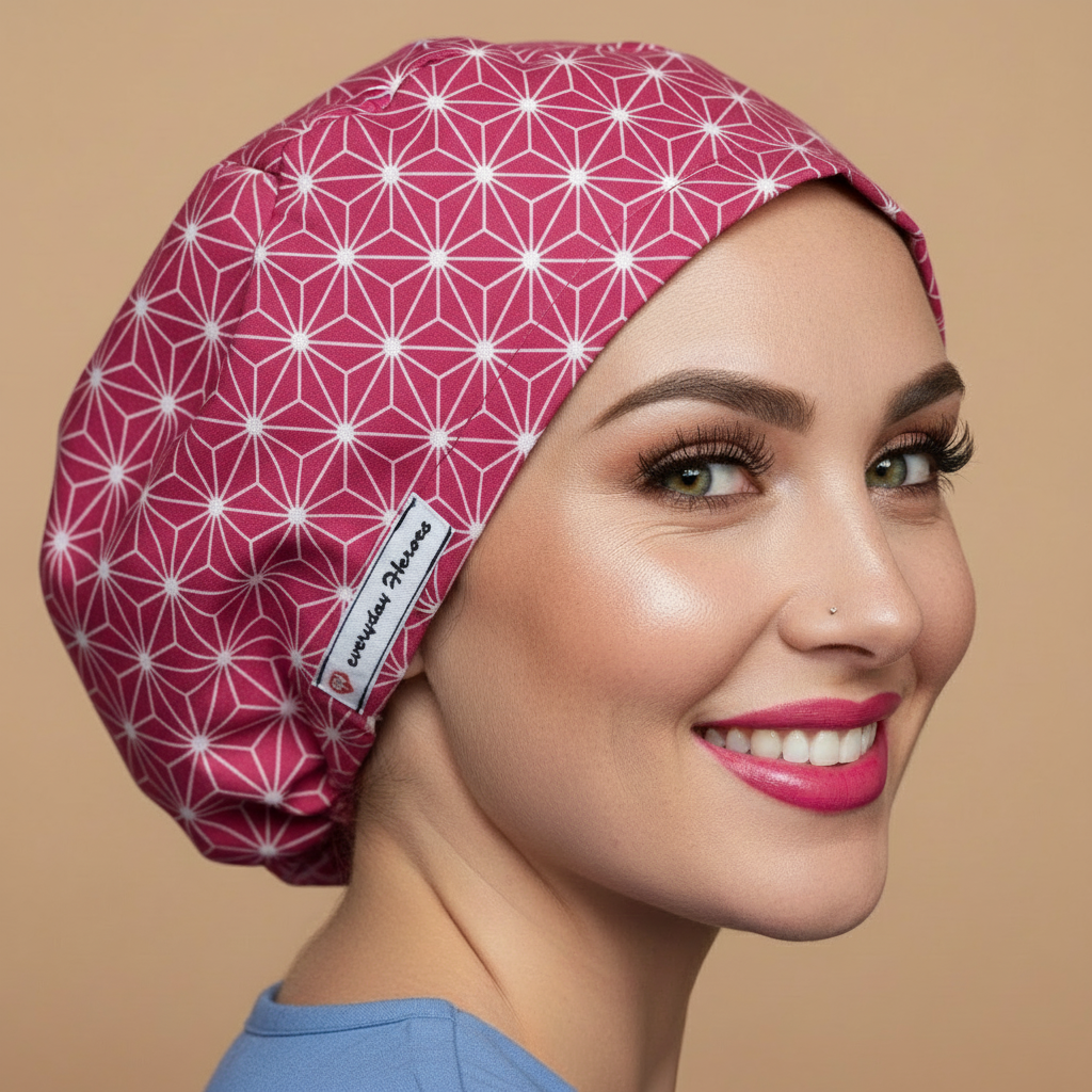 Sophisticated abstract scrub cap back side view with smiling healthcare professional - berry pink raspberry bouffant euro custom surgical cap featuring white geometric star pattern - satin lined OR anatomy nurse cap for women with adjustable fit - name personalized embroidery option - woman with hot pink lipstick green hazel eyes showing confident smile - Everyday Heroes brand label visible - professional medical headwear - asanoha Japanese geometric design - adjustable elastic fit for nurses doctors
