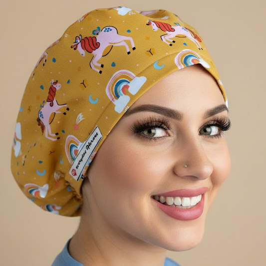 Consistent model in 3/4 angle wearing mustard yellow unicorn rainbow scrub cap