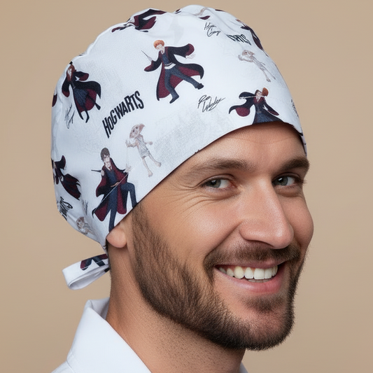 Man wearing a white scrub cap with Harry Potter design on a beige background