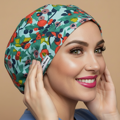 Red flower scrub cap with smiling healthcare professional - vibrant floral bouffant surgical hat featuring red flowers on satin finish - euro style OR cap for women with adjustable fit perfect for long hair - custom nurse scrub cap with name embroidery option - anatomical medical headwear for nurses doctors veterinarians - satin lined bouffant with elastic toggle closure - woman with hot pink lipstick green hazel eyes showing confident smile -  - professional medical apparel