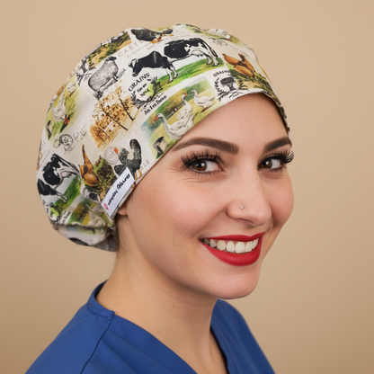 Woman in 3/4 angle looking at camera wearing farm animals scrub cap